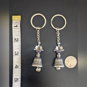 Silver Colored Bell Keychain with Red and Blue Accents for Couples